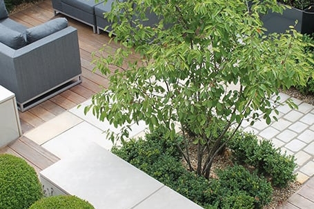 Beautiful outdoor rooms with all weather sofas. Contemporary planting design make for a cosy place to relax